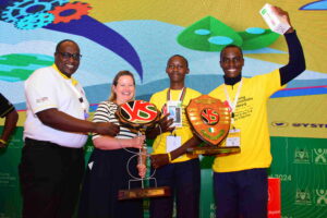 [From left] Young Scientists Kenya National Director, Dr. Eng. Victor Mwongera and the Deputy Ambassador of Ireland Ms. Evelyn Maris celebrate with Bradford Nyangiri and Felix Makori