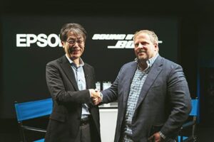 Epson COO Tomoo Takaso and Bose President & CSO Nick Smith Shake Hands to Formally Launch their Joint Projector Lineup, Combining Vivid Visuals with Custom Sound by Bose Audio.